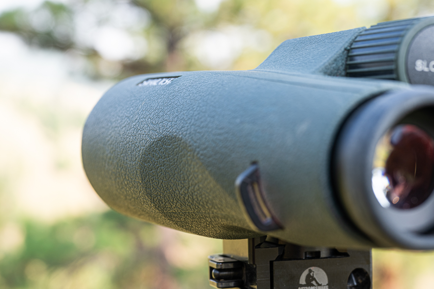 The author preferred the grippy micro-textured rubber armor of the 14x52 NL (top) to the coarser SLC armor (bottom).