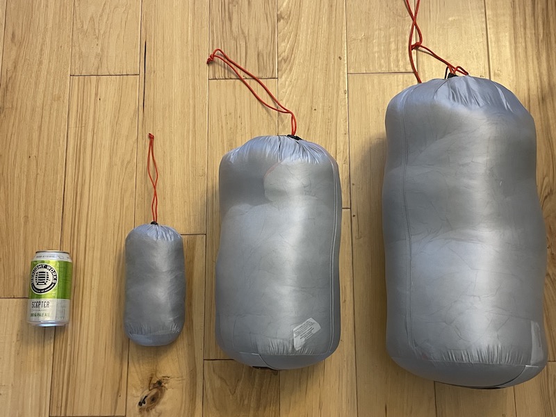 Argali Alpine sleeping bags and pillow in their stuff sacks.